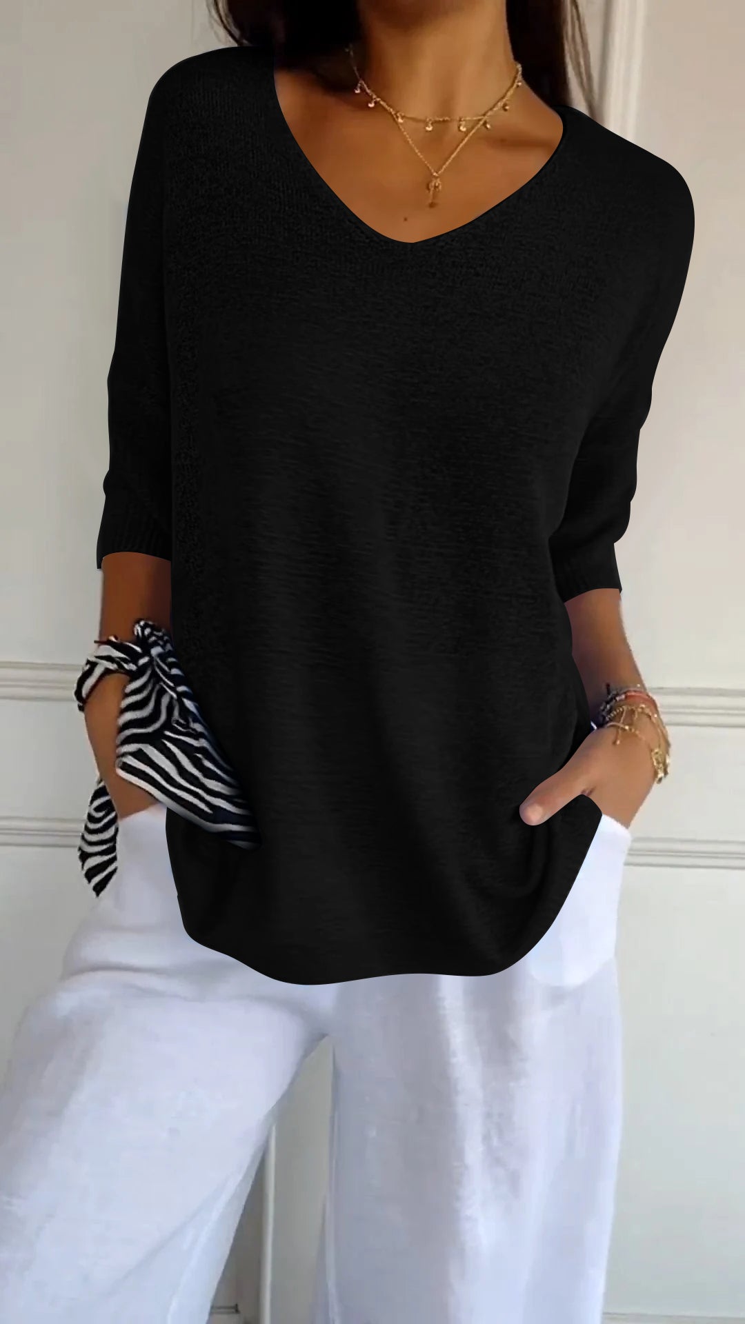 Solid-colored knit top with V-neck