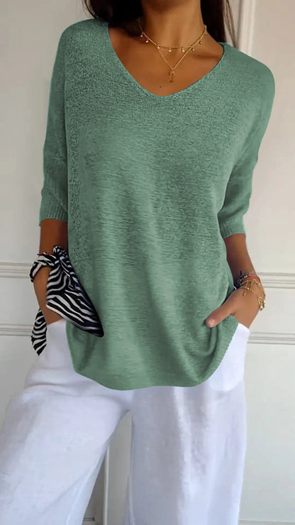 Solid-colored knit top with V-neck