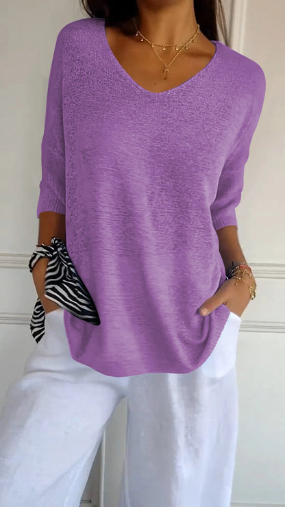 Solid-colored knit top with V-neck