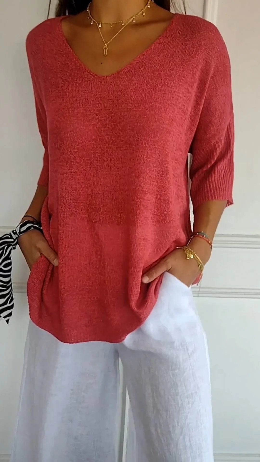 Solid-colored knit top with V-neck