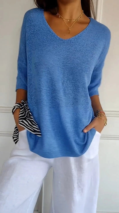 Solid-colored knit top with V-neck