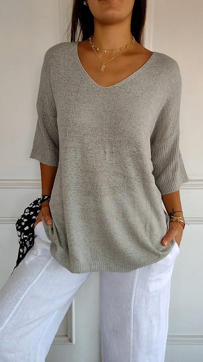 Solid-colored knit top with V-neck