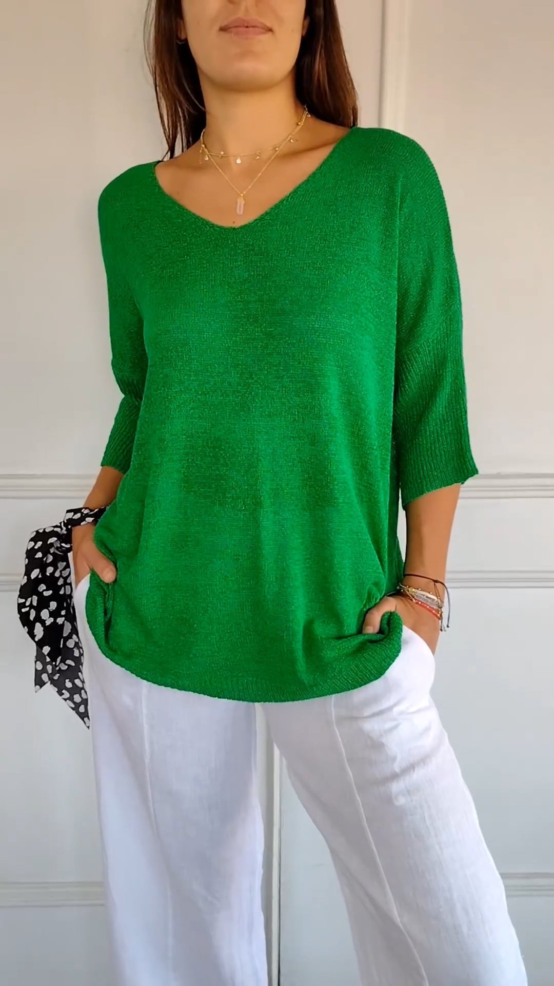 Solid-colored knit top with V-neck