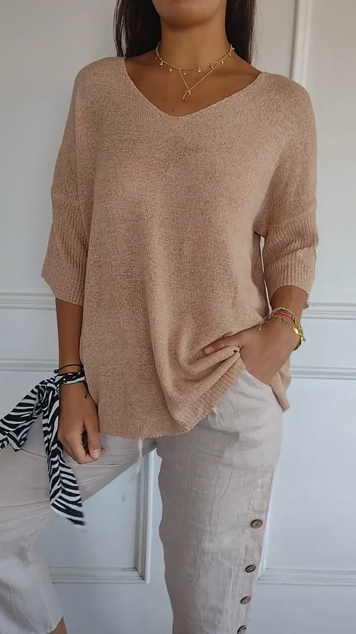 Solid-colored knit top with V-neck