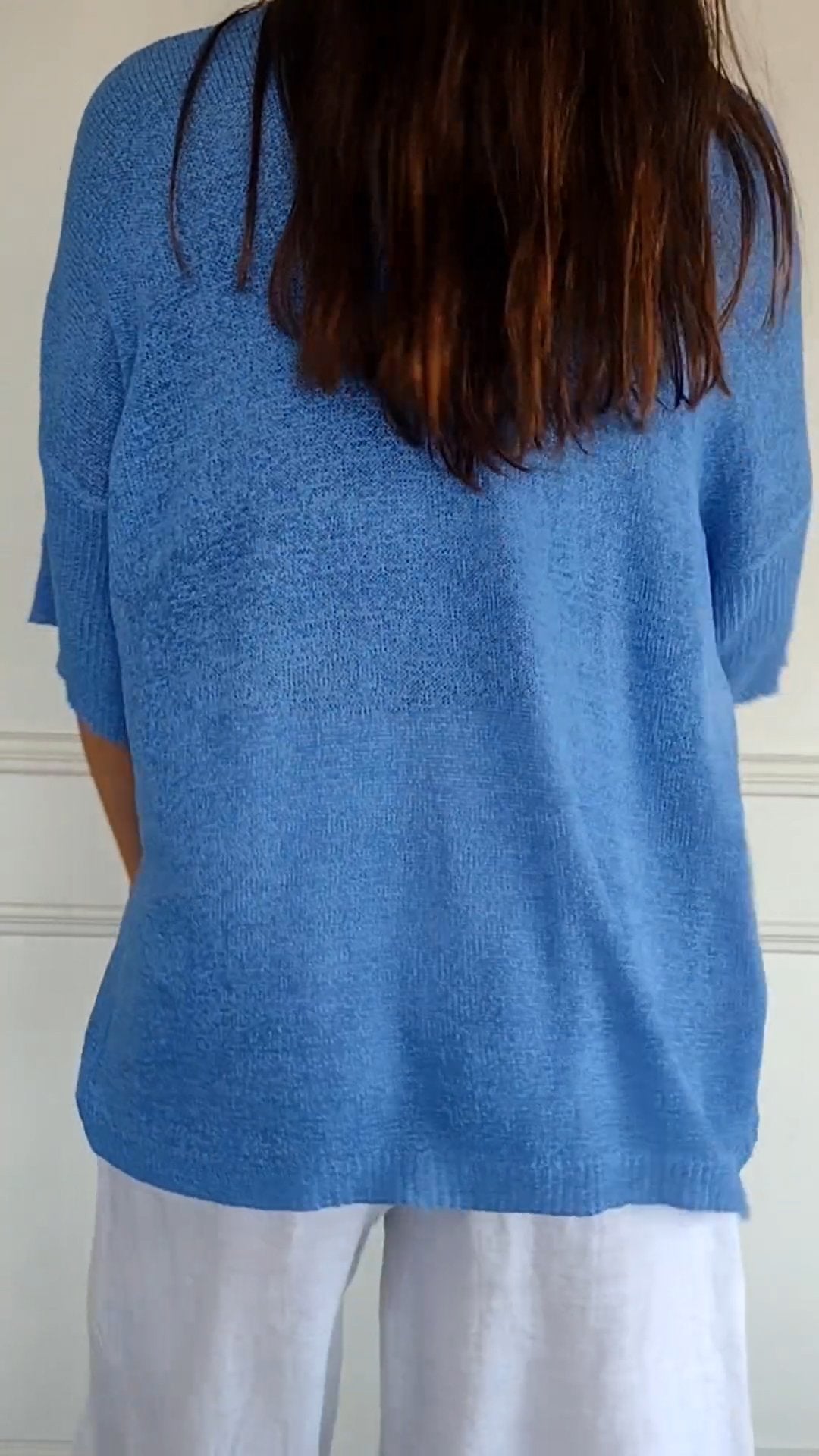 Solid-colored knit top with V-neck