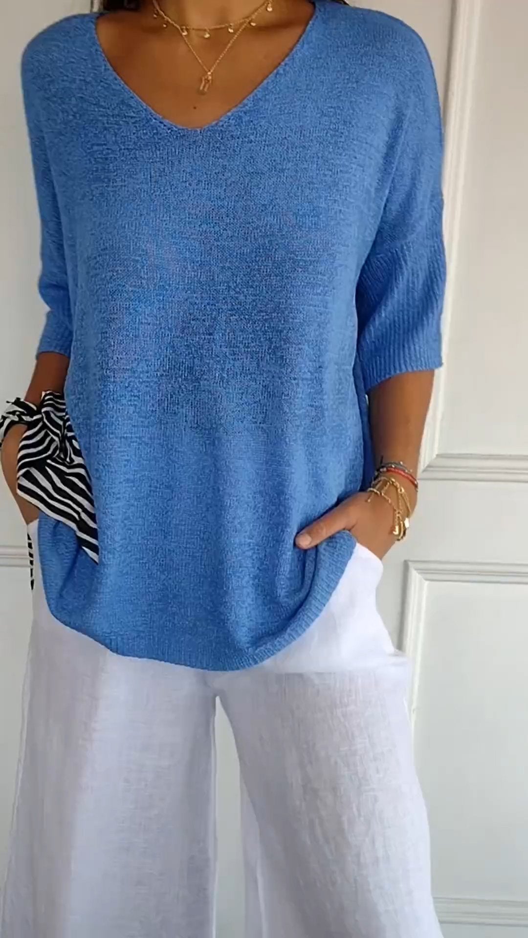 Solid-colored knit top with V-neck