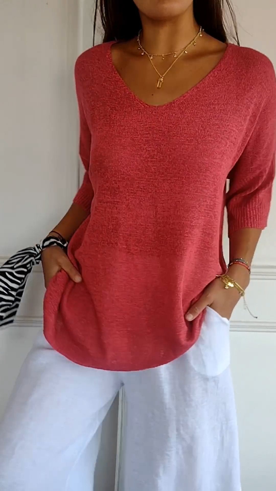 Solid-colored knit top with V-neck